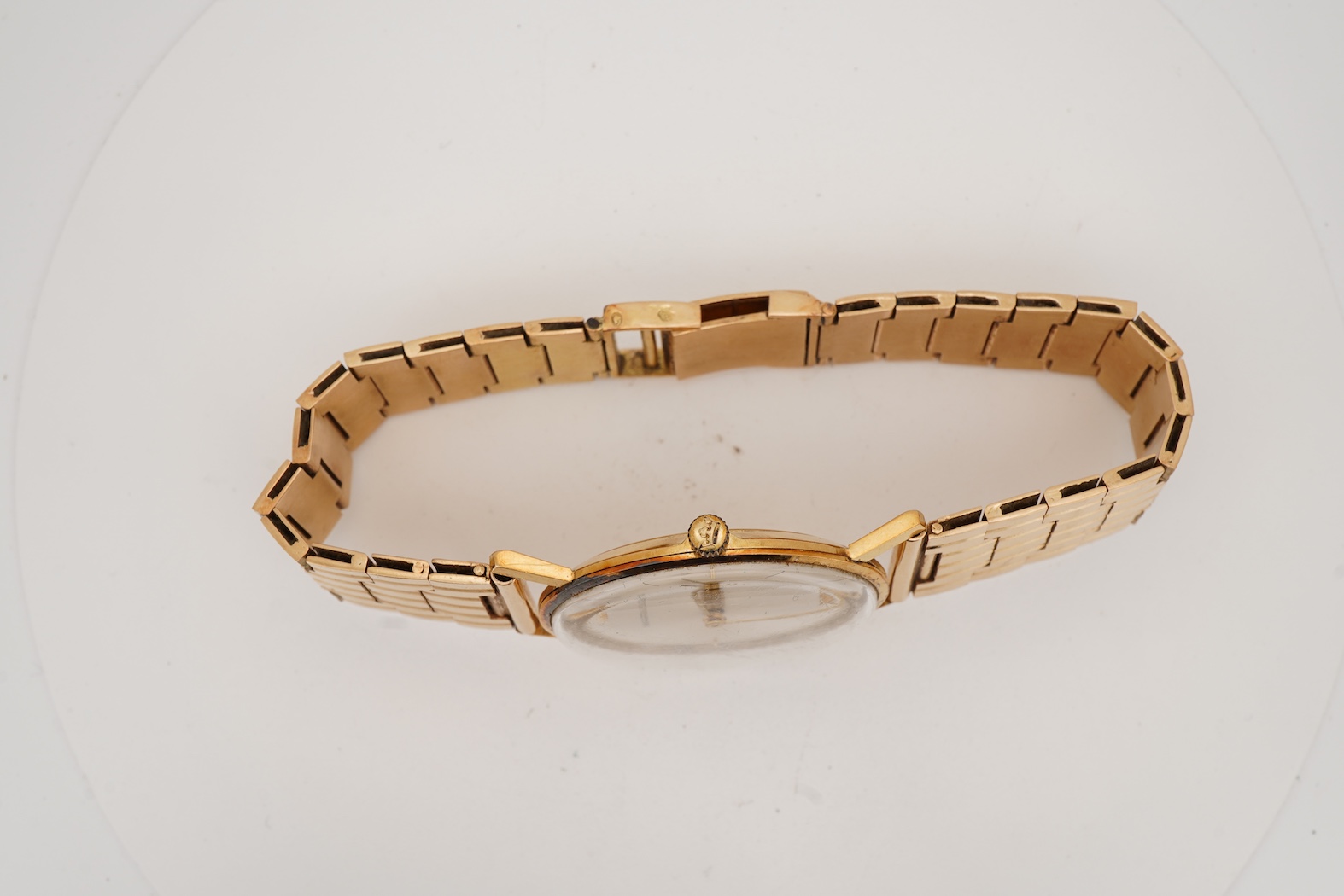 A gentleman's Swiss 18k gold Marvin manual wind dress wrist watch, with a Swiss 18k gold fancy brick link bracelet